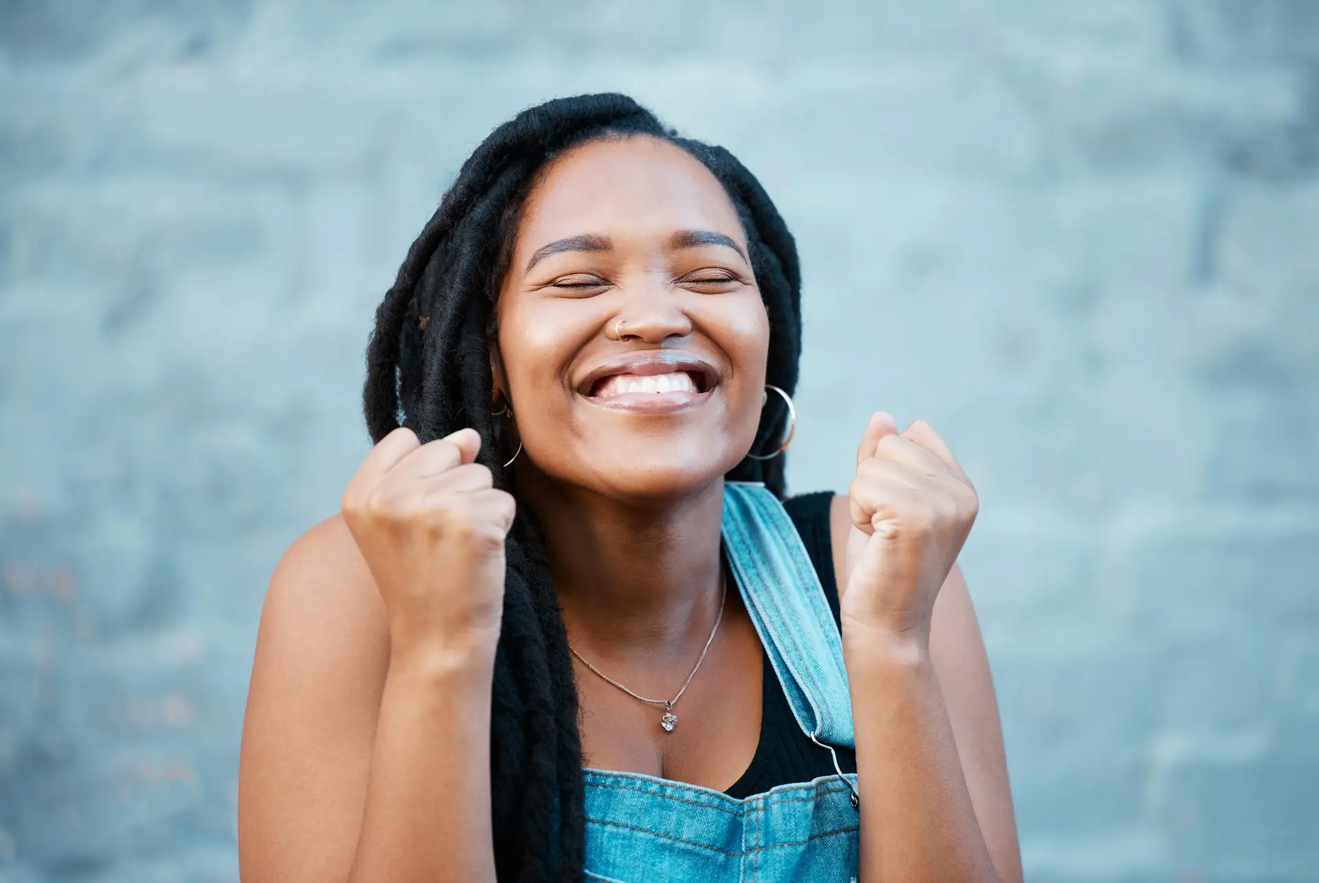 Black woman, happy and excited smile of a female from Jamaica feeling happiness. Smiling face of a